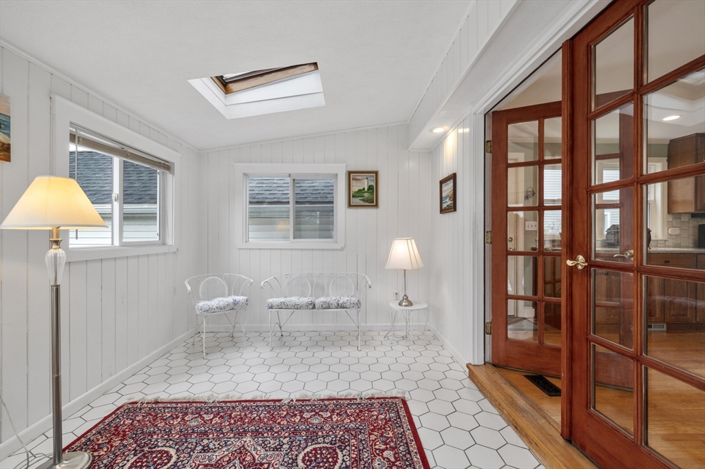 14 Arnold Road Peabody, MA 01960 - Photo 15 of 36 a bedroom with a bed and wooden floor