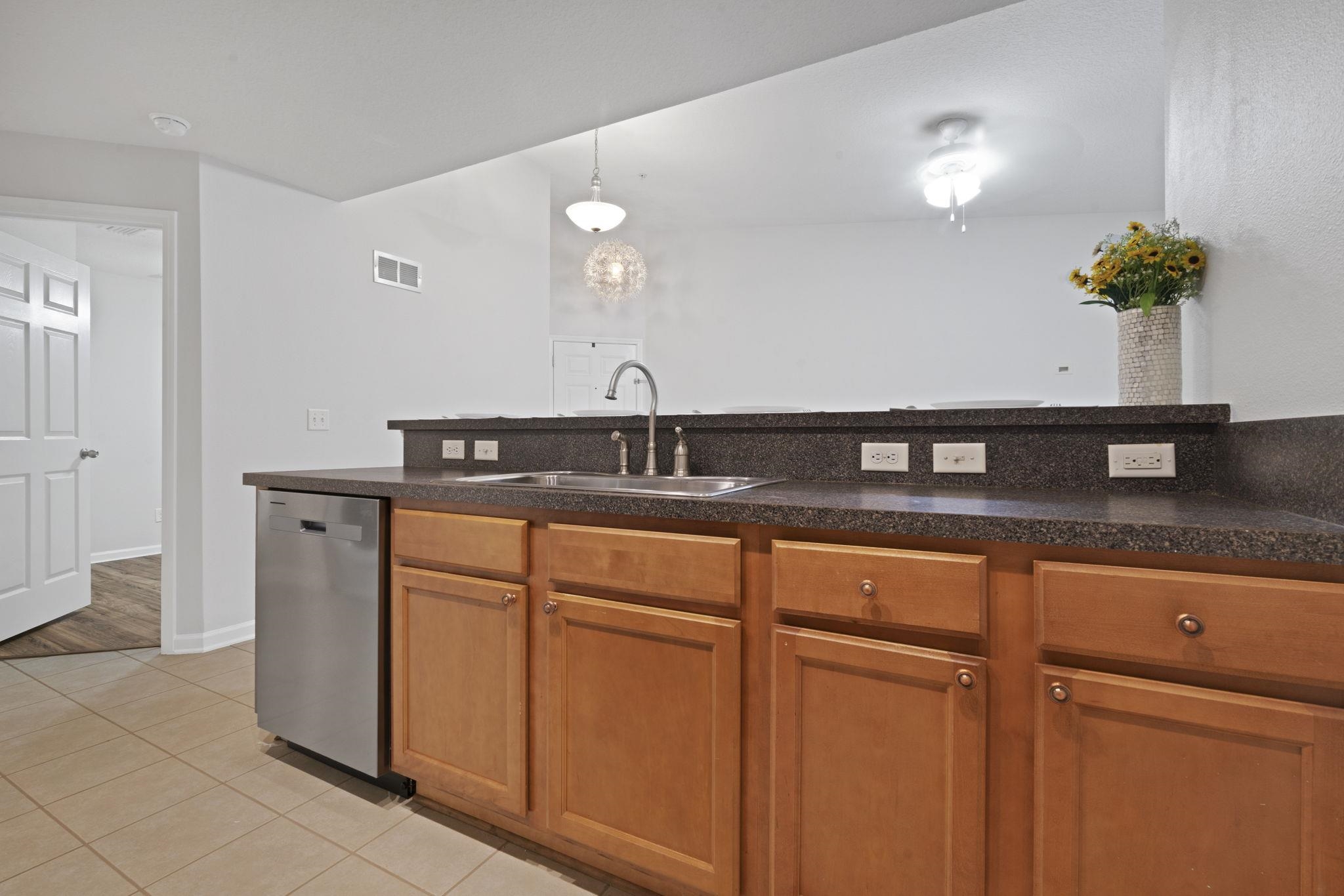 2441 Golden Lake Loop St. Augustine, FL 32084 - Photo 15 of 34 a kitchen with stainless steel appliances granite countertop a sink a stove and a refrigerator