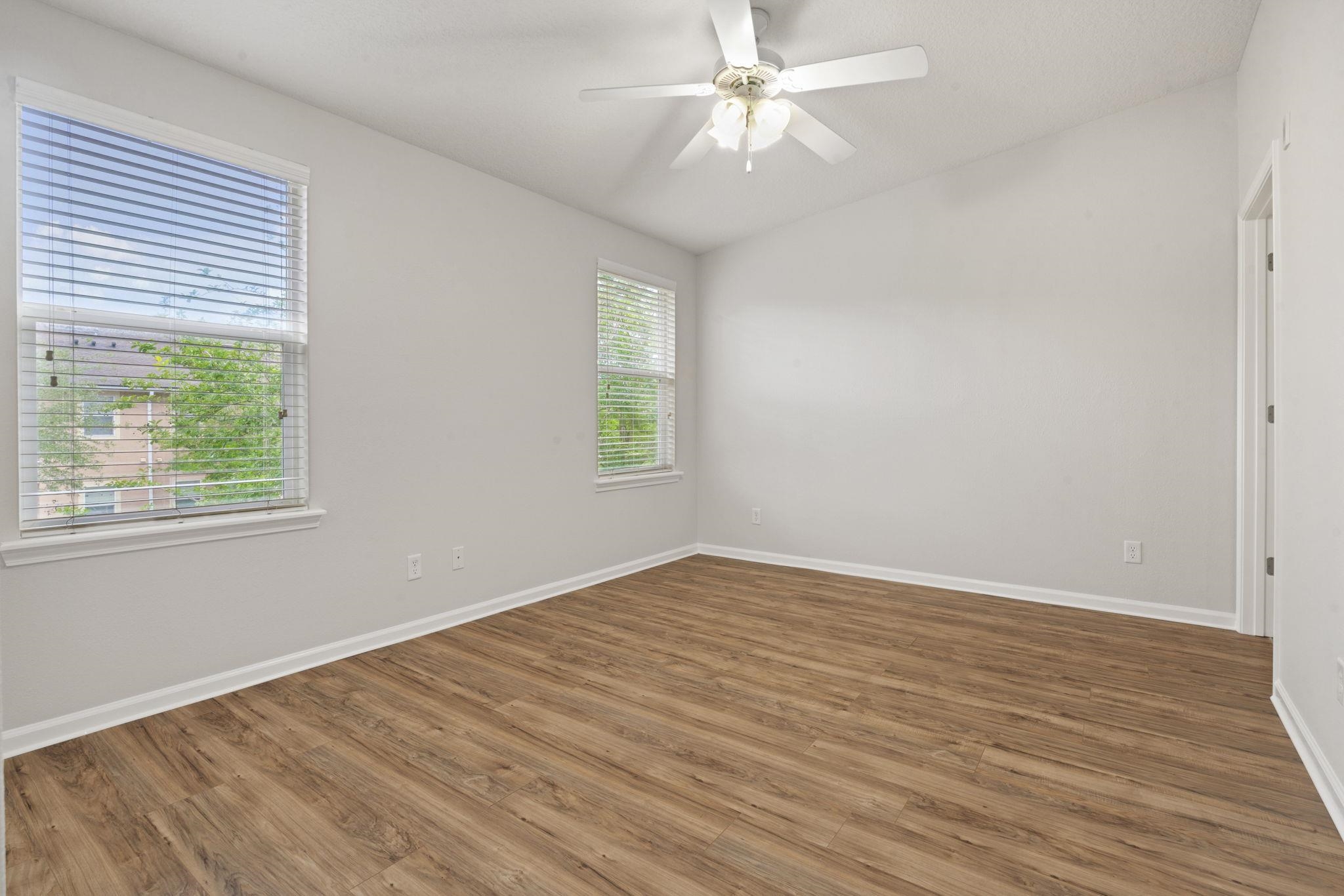 2441 Golden Lake Loop St. Augustine, FL 32084 - Photo 18 of 34 a view of empty room with wooden floor and fan