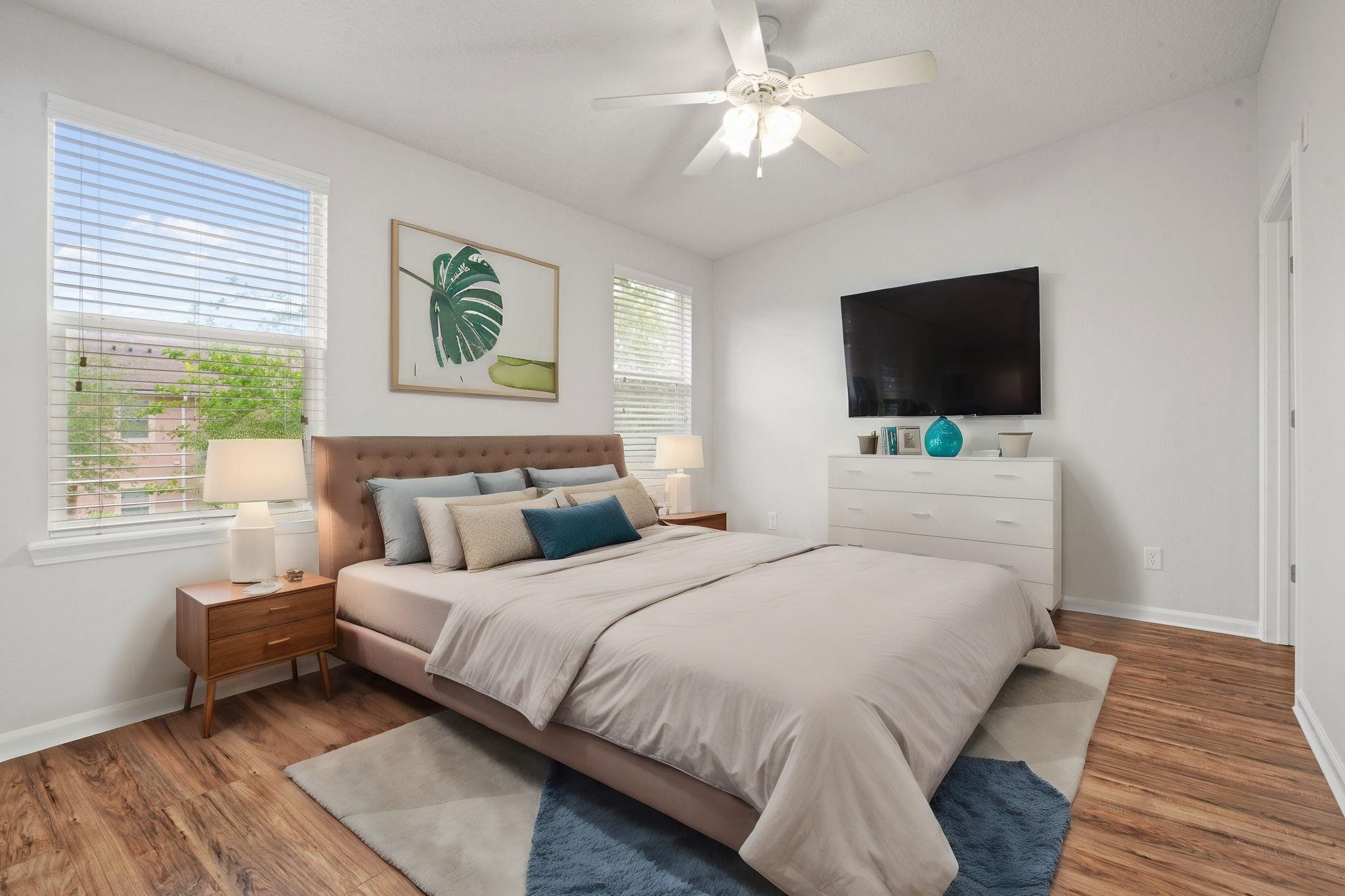 2441 Golden Lake Loop St. Augustine, FL 32084 - Photo 21 of 34 a bedroom with a bed and a flat screen tv