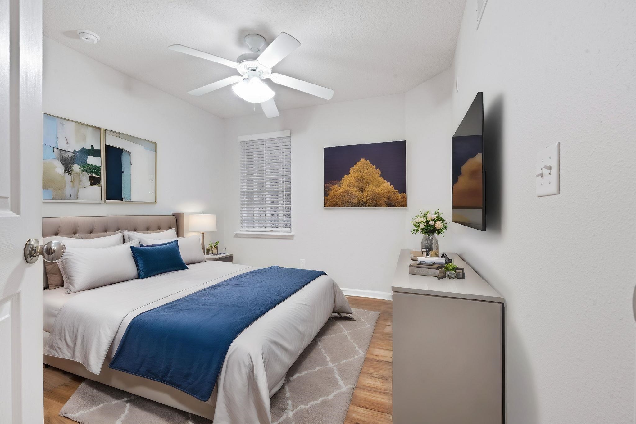 2441 Golden Lake Loop St. Augustine, FL 32084 - Photo 25 of 34 a bedroom with a bed and a flat screen tv