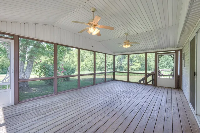 a view of a house with backyard porch and sitting area