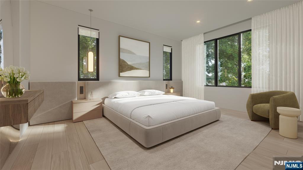 23 Benjamin Road Tenafly, NJ 07670 - Photo 6 of 6 a bedroom with a large bed and a couch