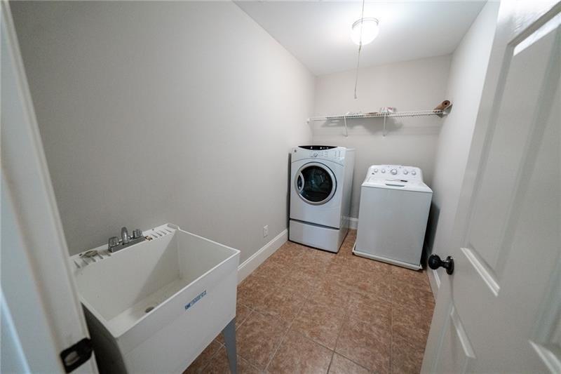 3245 Sparling Street Cumming, GA 30041 - Photo 22 of 59 a utility room with dryer and washer