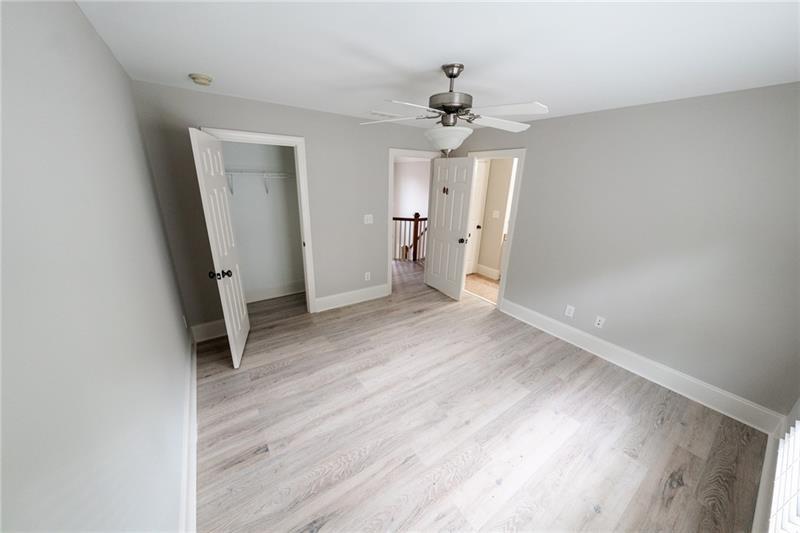 3245 Sparling Street Cumming, GA 30041 - Photo 29 of 59 wooden floor in an empty room with a window