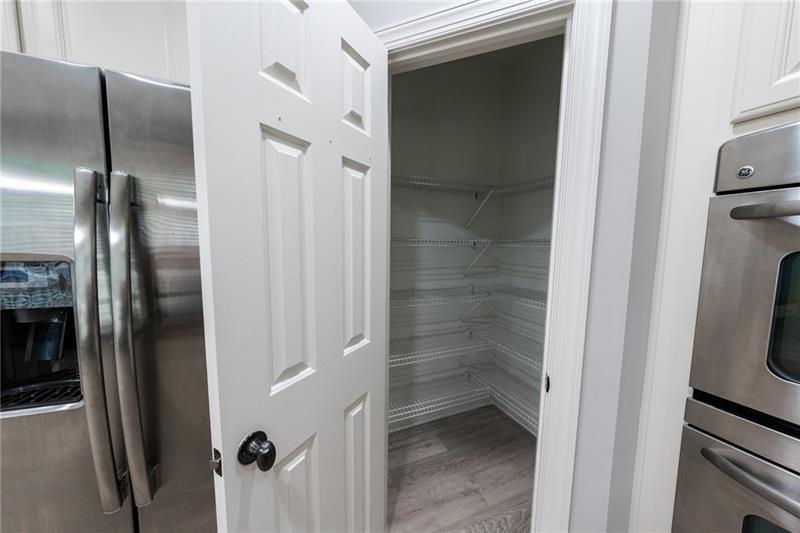 3245 Sparling Street Cumming, GA 30041 - Photo 3 of 59 a bathroom with a glass door shower and a sink