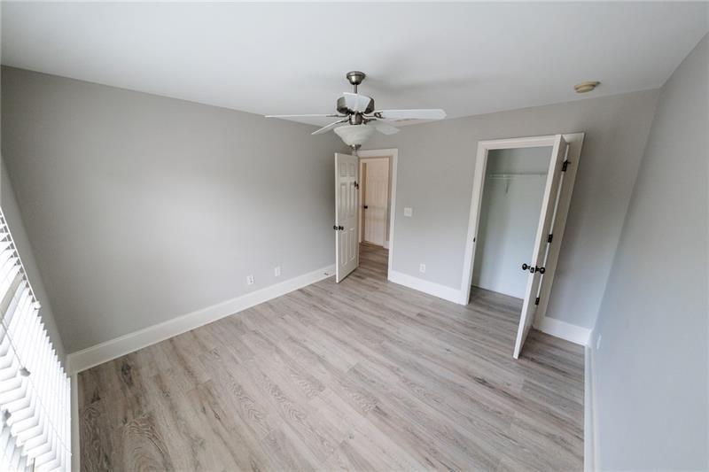 3245 Sparling Street Cumming, GA 30041 - Photo 32 of 59 wooden floor in an empty room with a window