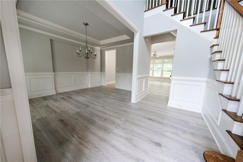 3245 Sparling Street Cumming, GA 30041 - Photo 5 of 59 a view of empty room with wooden floor and fan
