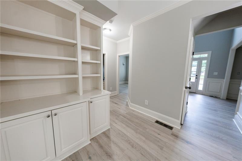 3245 Sparling Street Cumming, GA 30041 - Photo 6 of 59 a view of an empty room with a window