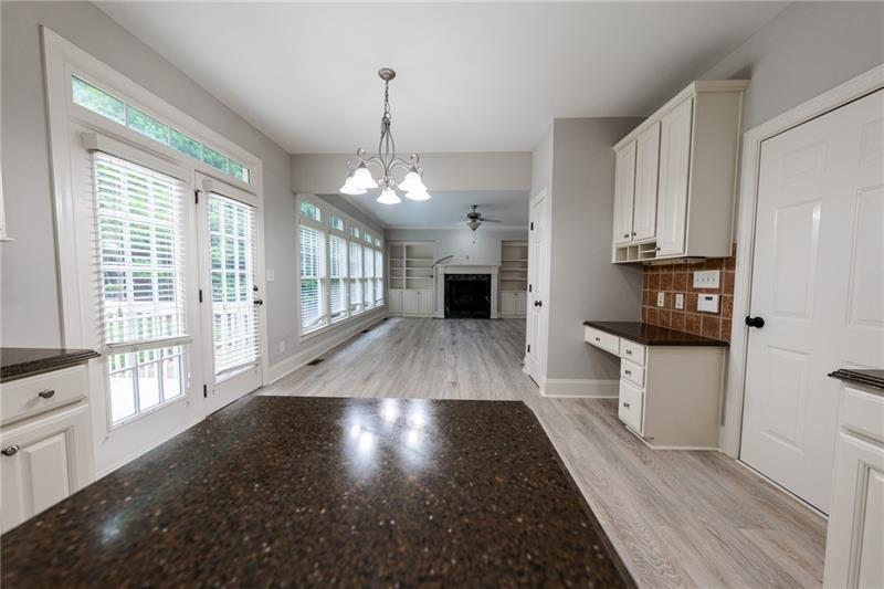3245 Sparling Street Cumming, GA 30041 - Photo 10 of 59 a view of a kitchen with a sink and a window