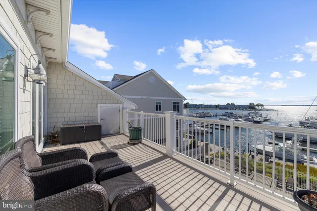 a bathroom with a granite countertop tub sink and mirror