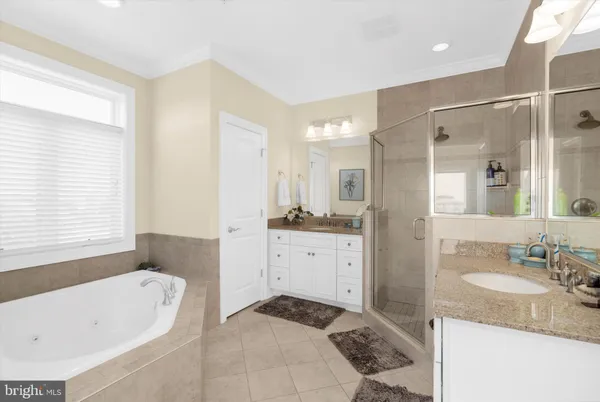 a bathroom with a tub and shower