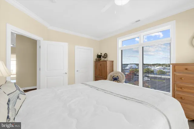 a bathroom with a granite countertop sink a toilet and a large mirror