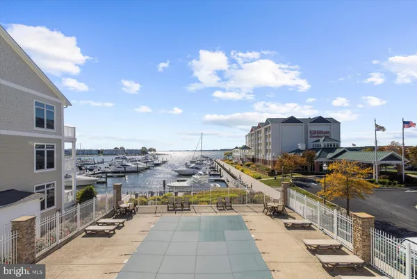 a view of a balcony with wooden floor