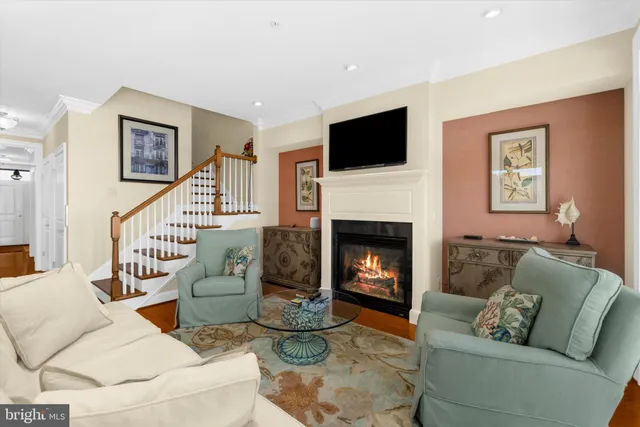 a living room with furniture fireplace and a flat screen tv