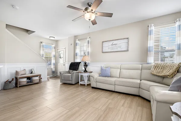 a living room with furniture and a large window