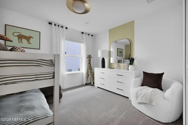 a bedroom with bed and a window