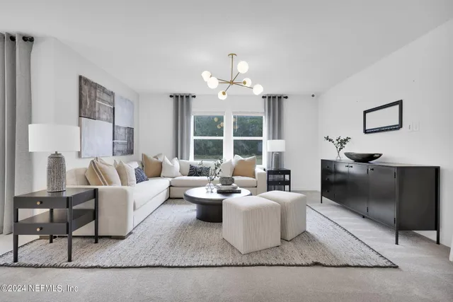 a large bedroom with bed and a window