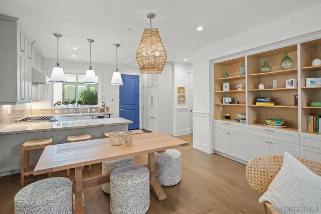 a dining room with furniture a window and kitchen view