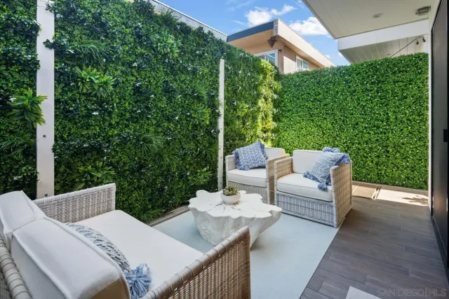 a view of a patio in the backyard