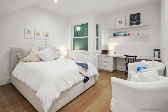 a bedroom with a bed and a couch