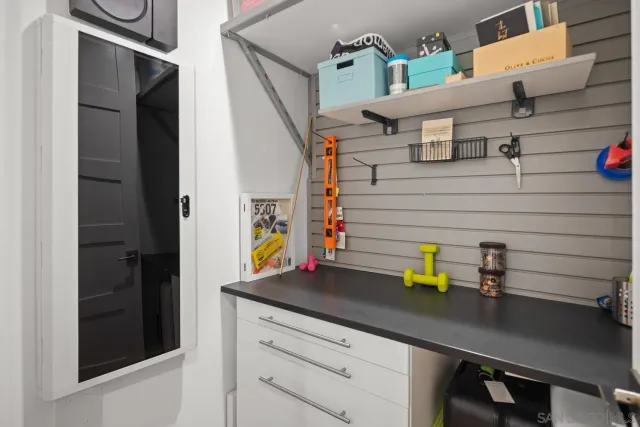 a utility room with sink dryer and washer