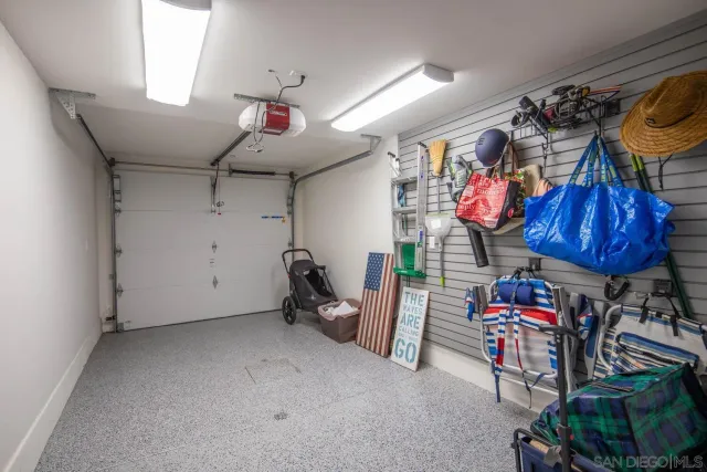 a front view of a building with cars