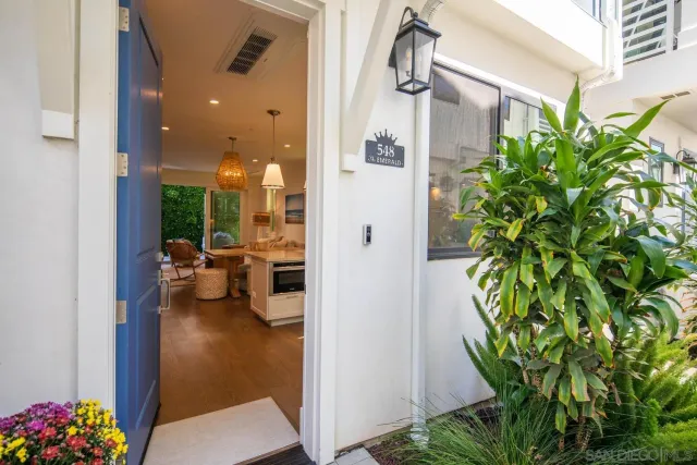a view of a lobby with patio door and couches