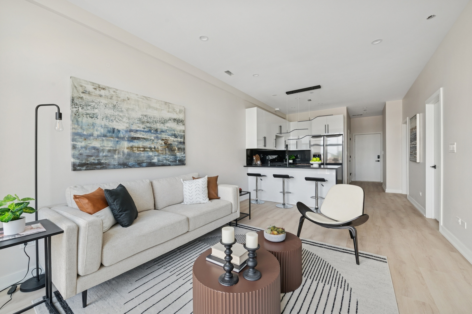 1355 North Western Avenue, Unit 2B Chicago, IL 60622 - Photo 5 of 16 a living room with furniture a rug and a table