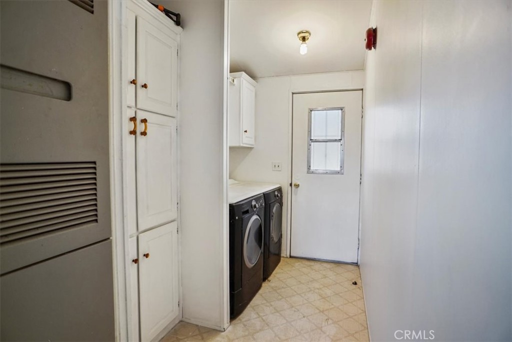 34525 Red Rover Mine Road Acton, CA 93510 - Photo 12 of 23 a view of a hallway with washer and dryer