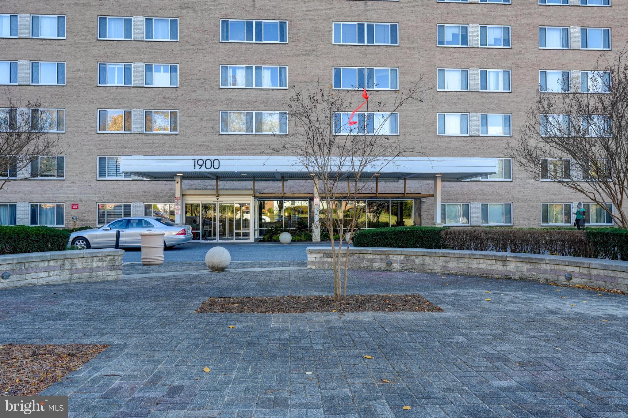 1900 Lyttonsville Road, Unit 211 Silver Spring, MD 20910 - Photo 45 of 46 a front view of building with cars parked