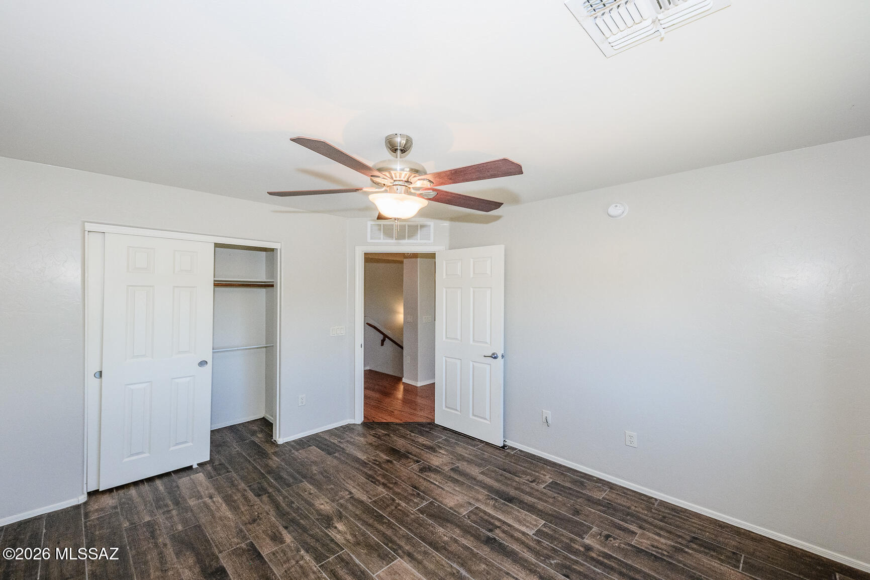 728 South Porter Routh Place Vail, AZ 85641 - Photo 21 of 36 a view of a livingroom with wooden floor and a ceiling fan