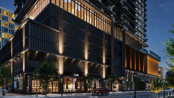 a lobby with furniture and potted plants
