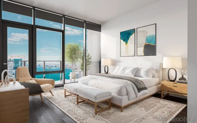 a bedroom with a bed and a large window