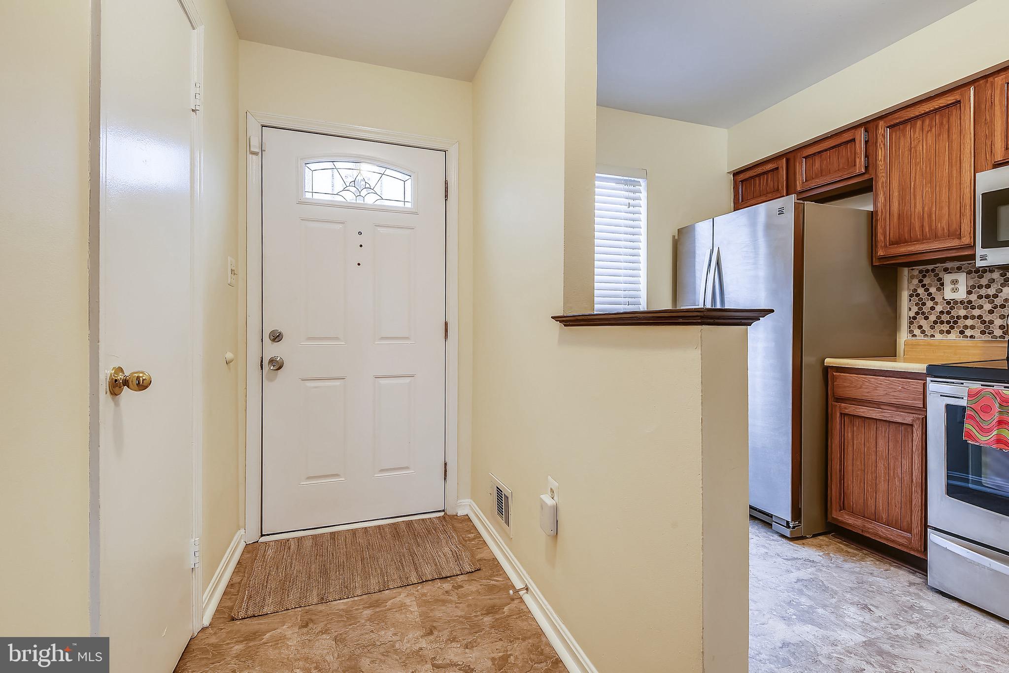 3028 Shepperton Terrace Silver Spring, MD 20904 - Photo 10 of 49 Foyer, with gleaming wood catch all counter.