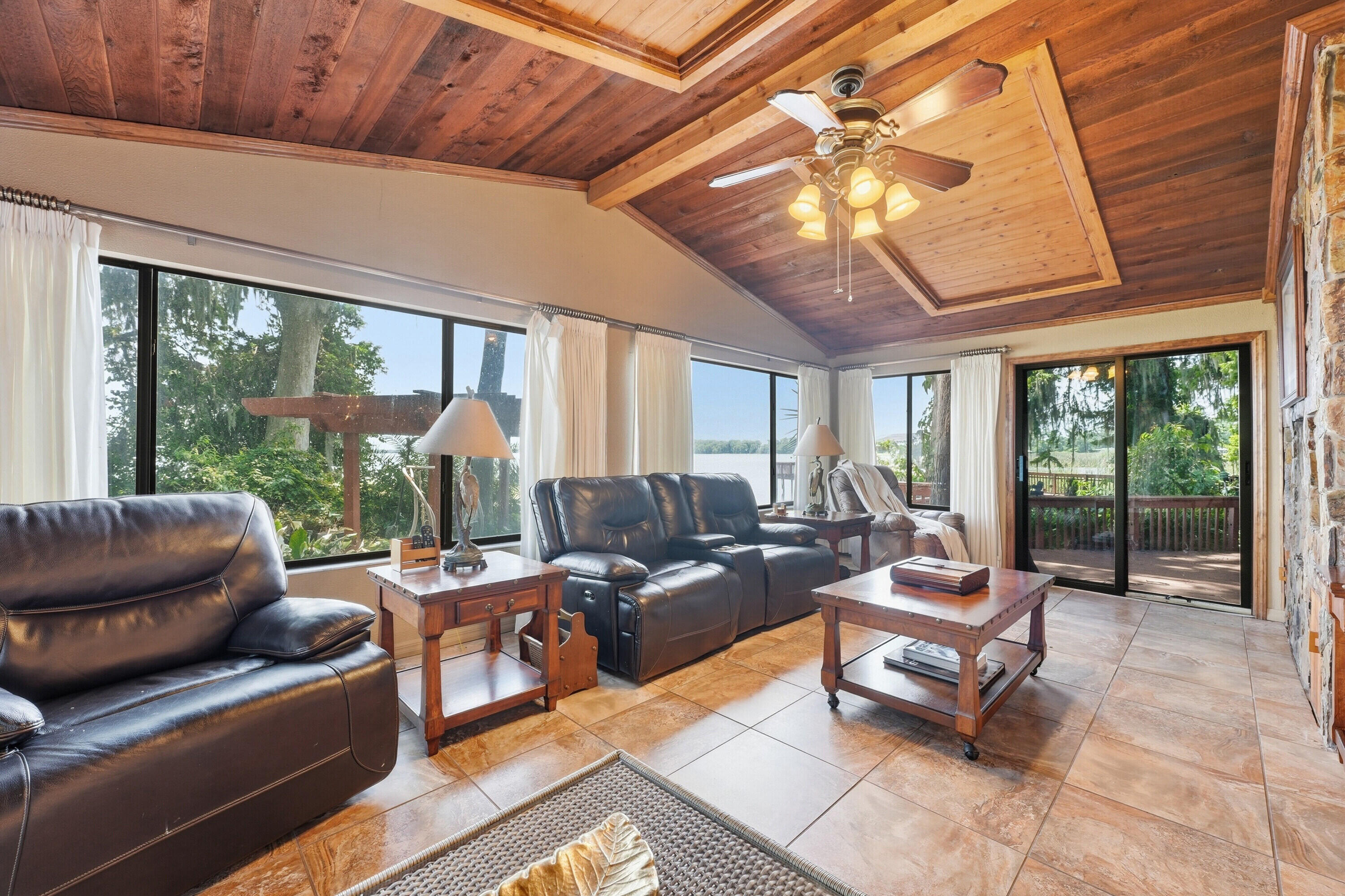 200 Windy Point Road Lake Placid, FL 33852 - Photo 11 of 74 a living room with furniture and a large window