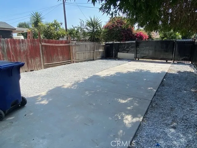 a swimming pool with wooden fence