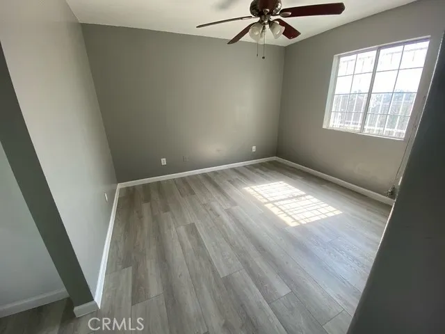 a view of an empty room and a window