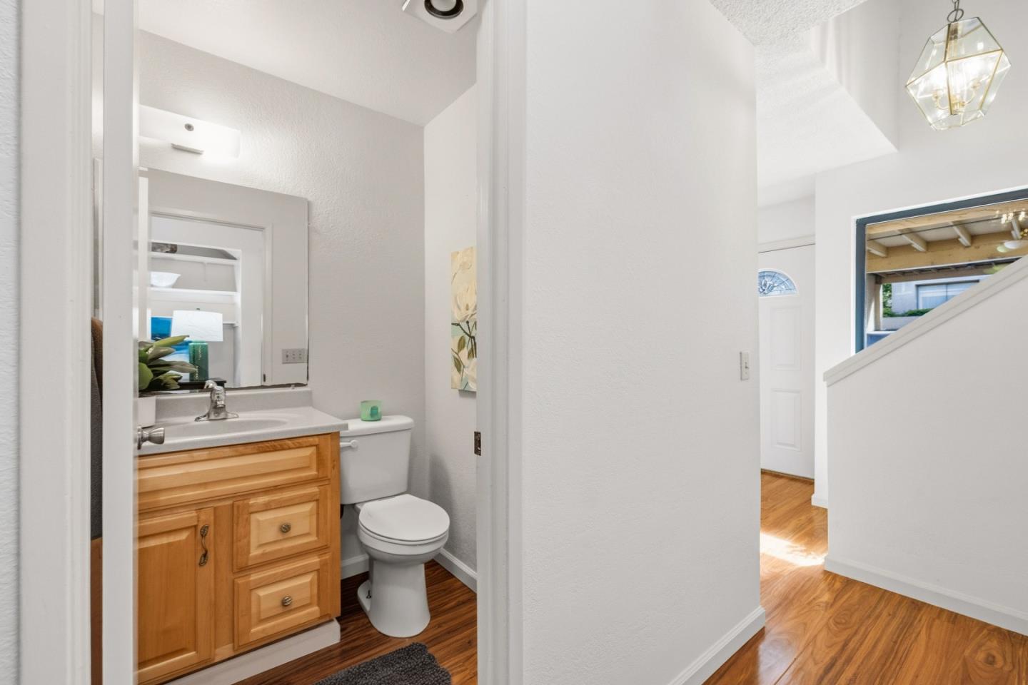 1186 Trinity Avenue Seaside, CA 93955 - Photo 13 of 33 a bathroom with a granite countertop toilet a sink and a mirror