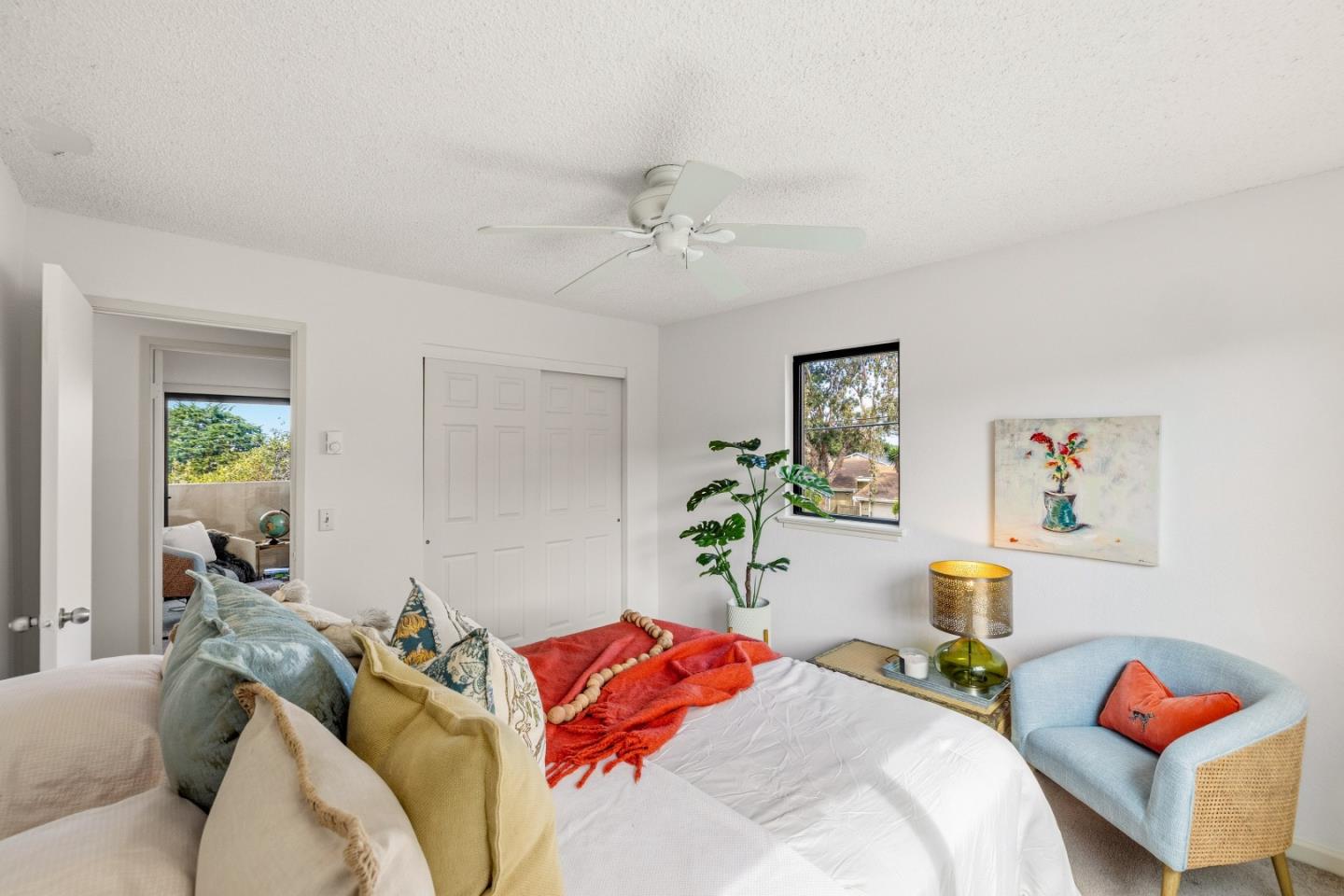 1186 Trinity Avenue Seaside, CA 93955 - Photo 16 of 33 a bedroom with a bed and a chandelier