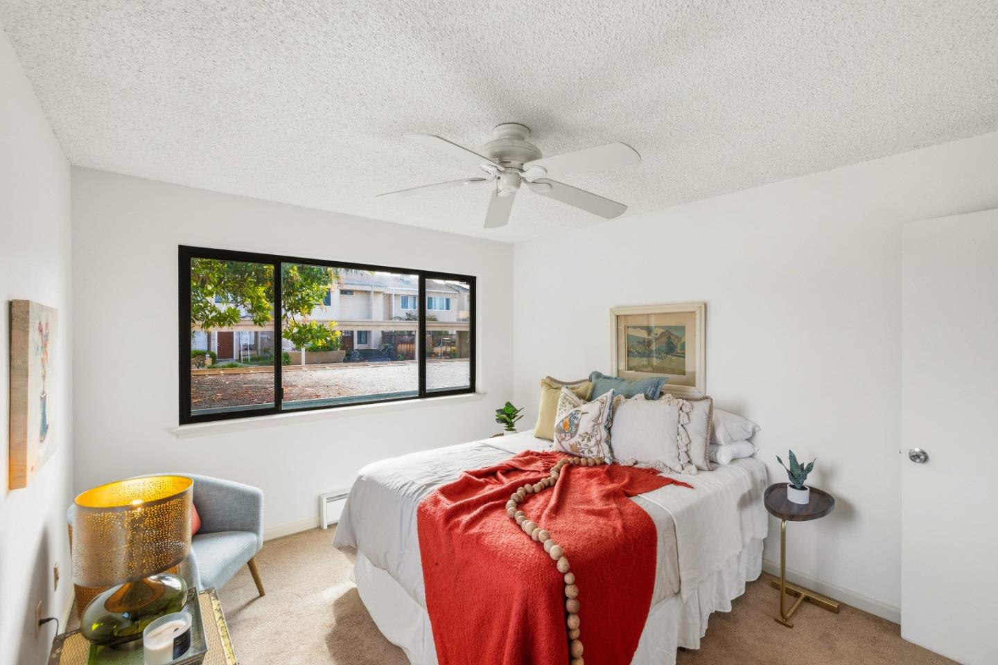 1186 Trinity Avenue Seaside, CA 93955 - Photo 17 of 33 a bedroom with a bed and ceiling fan