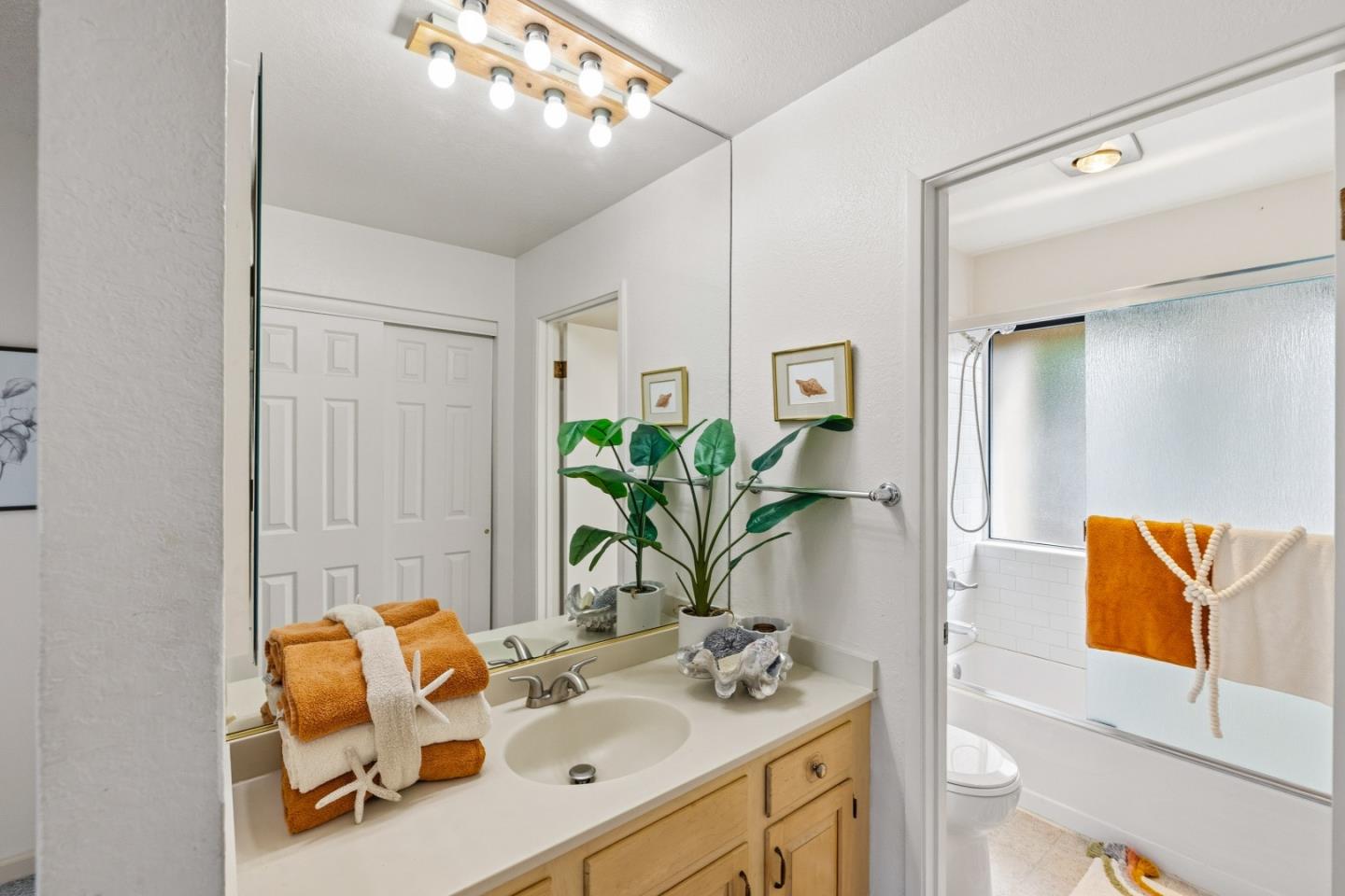 1186 Trinity Avenue Seaside, CA 93955 - Photo 18 of 33 a bathroom with a sink mirror and vanity