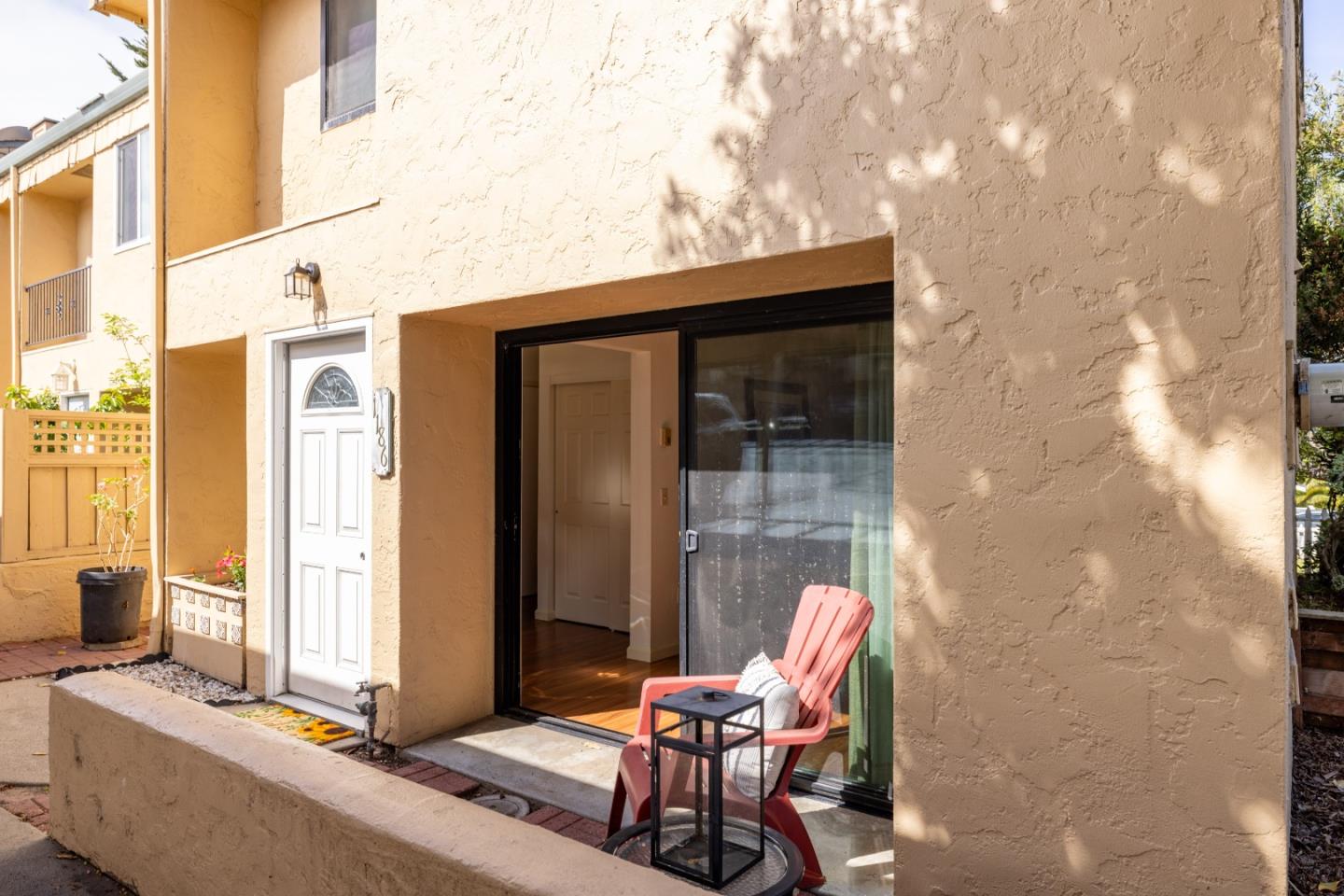 1186 Trinity Avenue Seaside, CA 93955 - Photo 33 of 33 a patio with table and chairs and potted plants