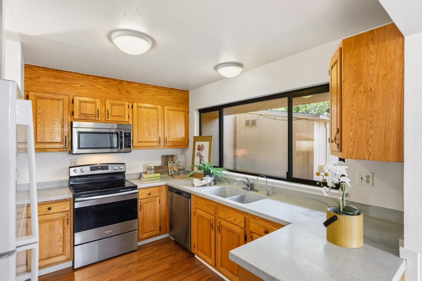 1186 Trinity Avenue Seaside, CA 93955 - Photo 9 of 33 a kitchen with stainless steel appliances a stove sink and microwave