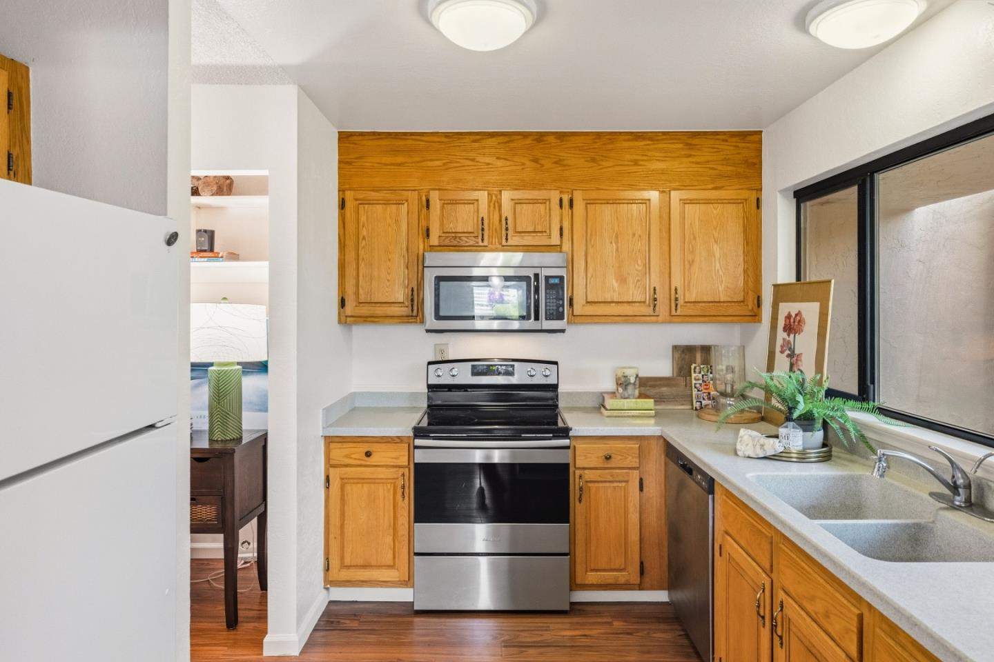 1186 Trinity Avenue Seaside, CA 93955 - Photo 10 of 33 a kitchen with a stove a sink and a refrigerator