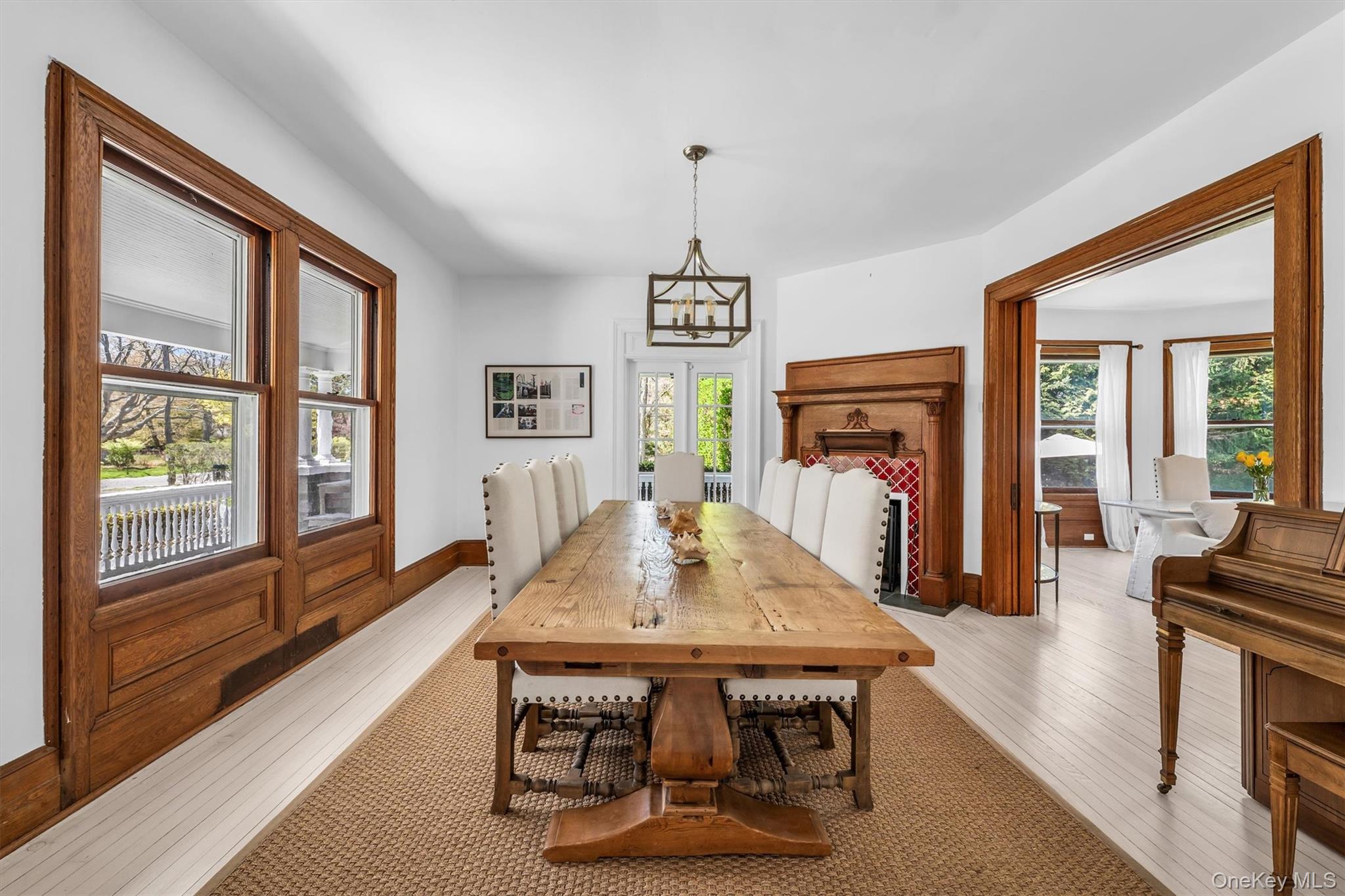 64 South Howells Point Road Bellport, NY 11713 - Photo 16 of 42 a view of a dining room with furniture window and wooden floor