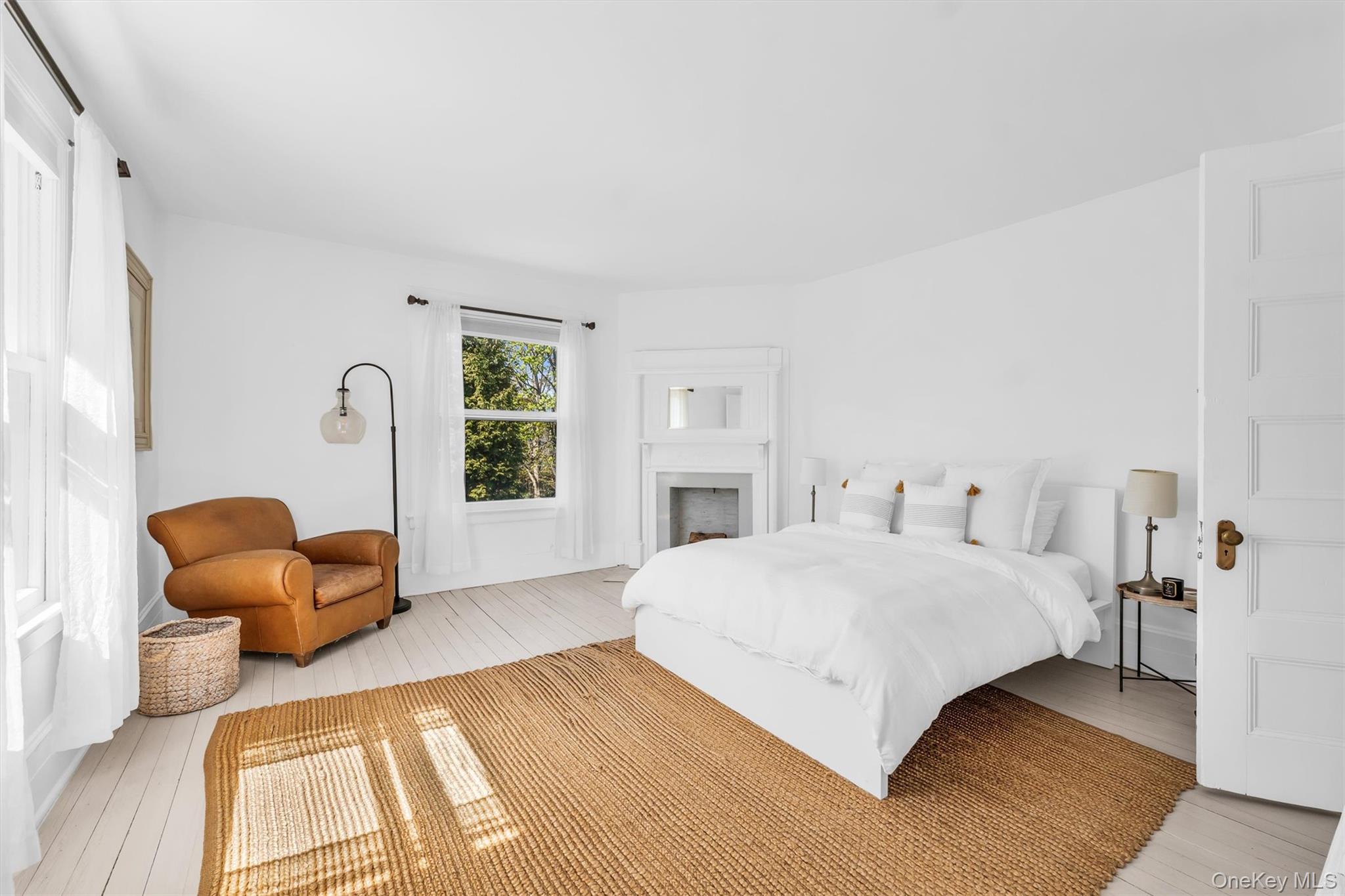64 South Howells Point Road Bellport, NY 11713 - Photo 25 of 42 a bedroom with a bed and a couch