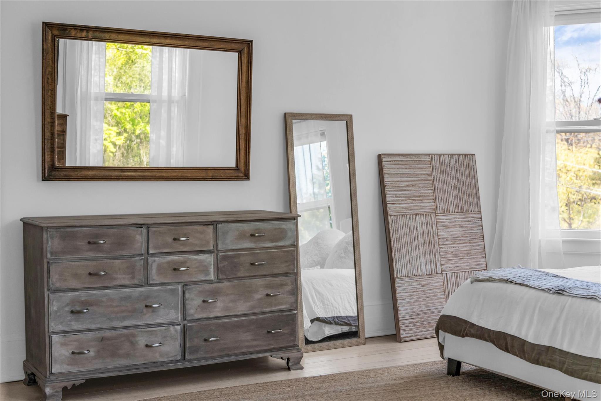 64 South Howells Point Road Bellport, NY 11713 - Photo 26 of 42 a bedroom with a bed and a window