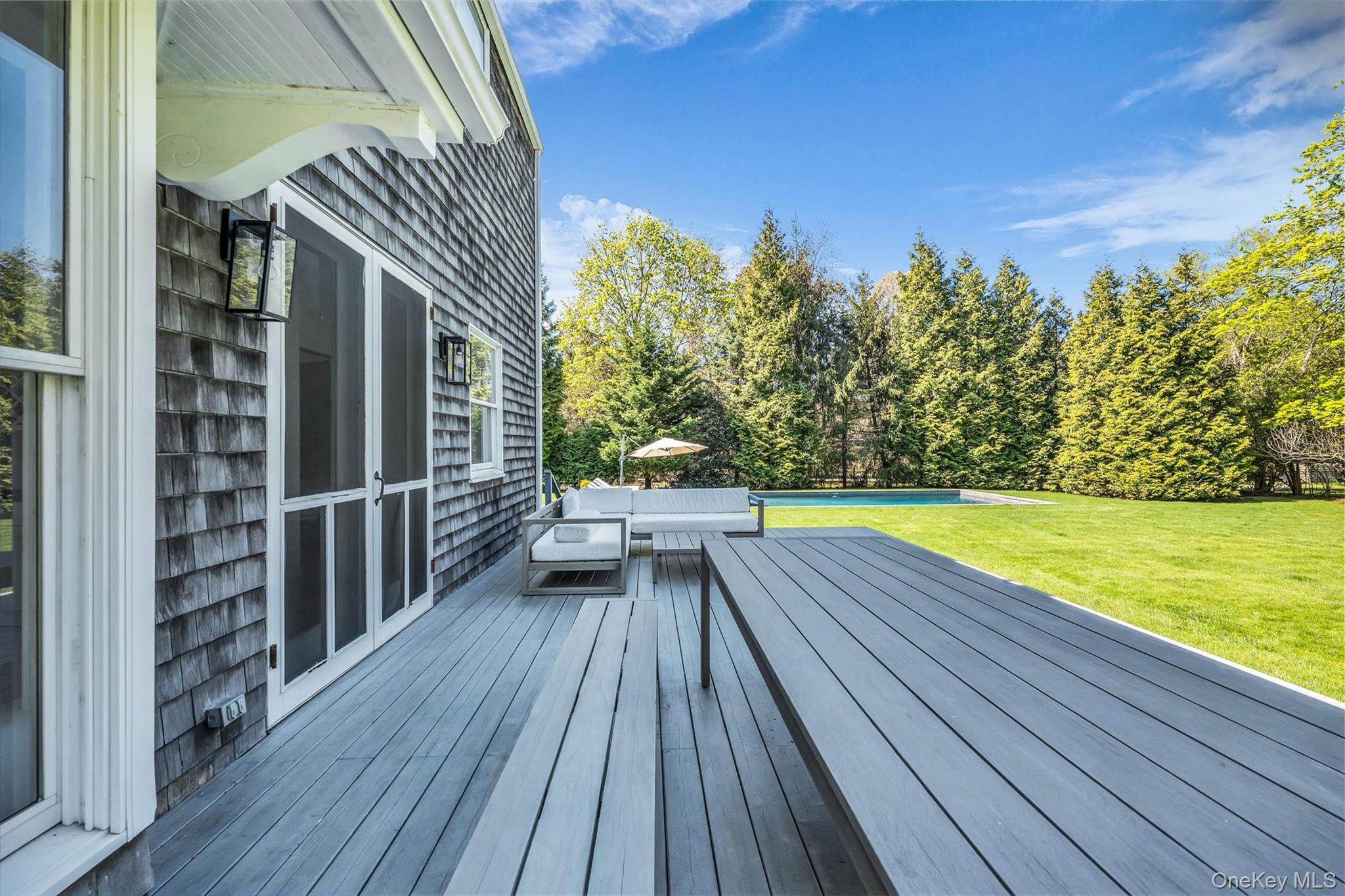 64 South Howells Point Road Bellport, NY 11713 - Photo 38 of 42 a view of balcony with wooden floor and fence