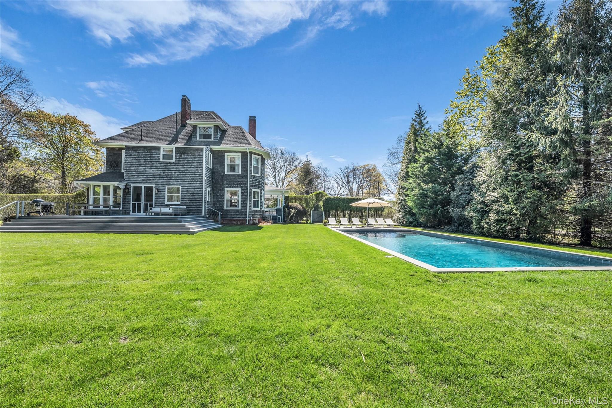 64 South Howells Point Road Bellport, NY 11713 - Photo 40 of 42 a view of a house with a yard